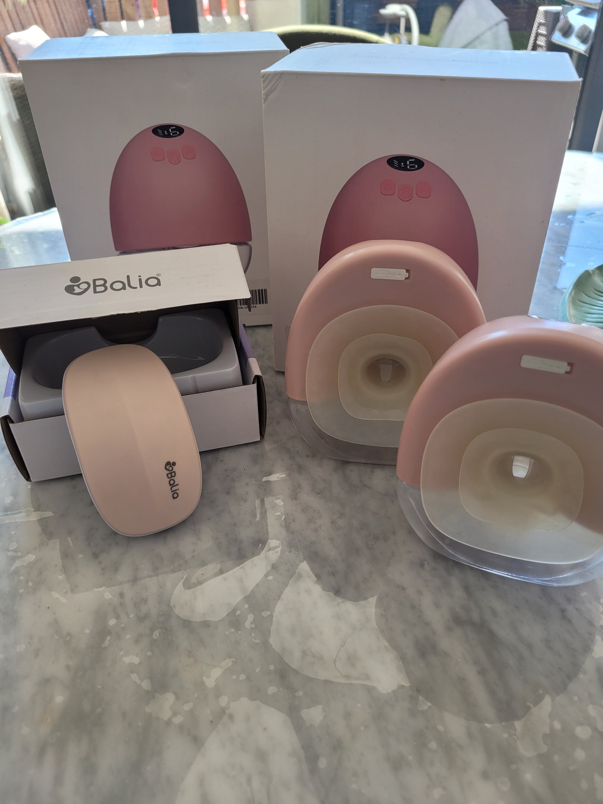 (#PG5135) Extractor de leche doble eléctrico + Masajeador de lactancia color rosado. Marca Supermom y Balia