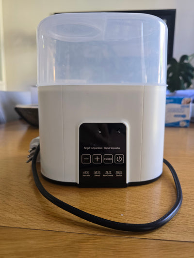 (#PG5436) Calentador y Esterilizador de mamaderas. Marca Genérica