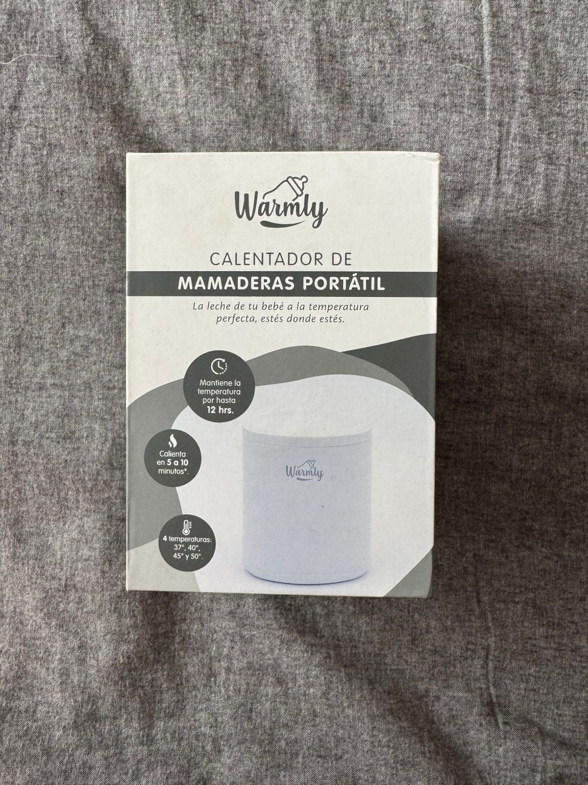 (#PG5397) Calentador de mamaderas portátil. Marca Warmly