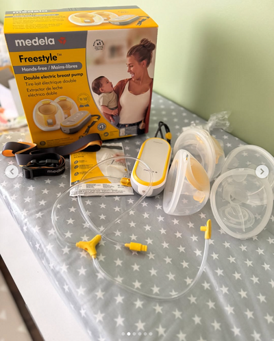 Extractor de leche doble eléctrico modelo Freestlye hands-free. Marca Medela (#PG5800)
