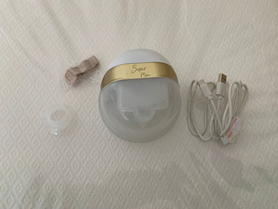 (#PG3907) Extractor de leche eléctrico + 53 bolsas de almacenamiento de leche. Marca Super Mom